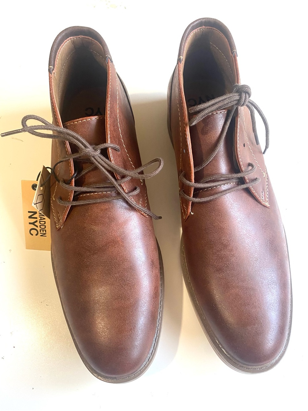 Madden NYC Men's Adam Lace-Up Chukka
Boots in the cognac/ brown colorway.